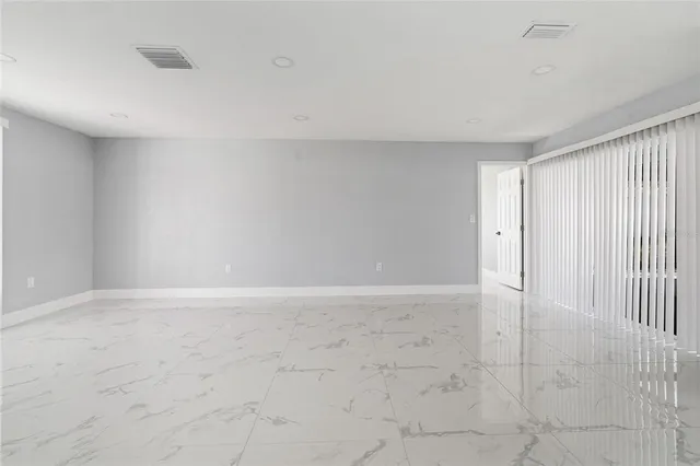 a view of an empty room and window