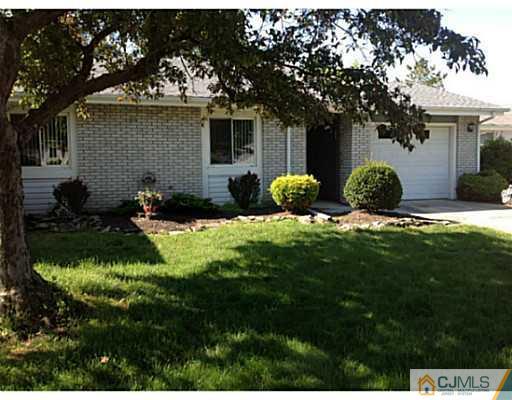 273 B Convent Road Monroe Township, NJ 08831 - Photo 1 of 15 a front view of house with yard and green space