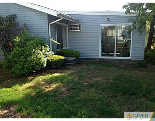 273 B Convent Road Monroe Township, NJ 08831 - Photo 14 of 15 a front view of a house with a yard