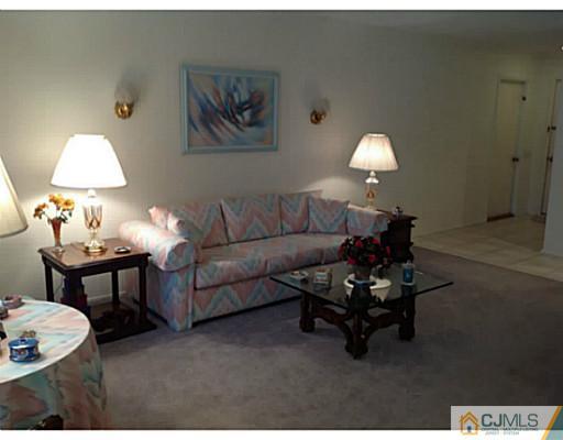 273 B Convent Road Monroe Township, NJ 08831 - Photo 4 of 15 a living room with furniture and a lamp