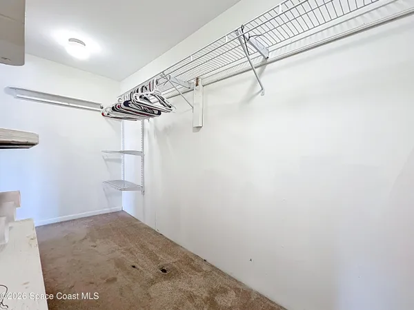 a view of a room with racks on the wall