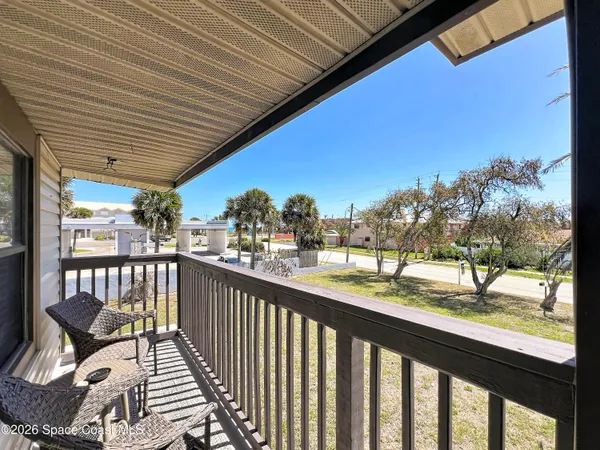 a view of a chairs and table in patio