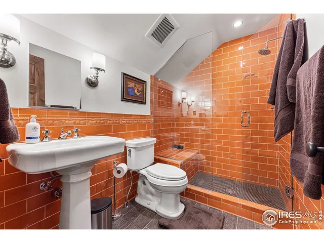 a living room with furniture gym equipment and a large window