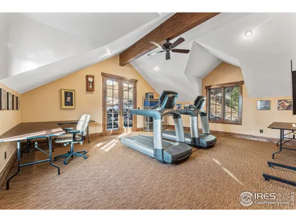 a room with gym equipment and a table