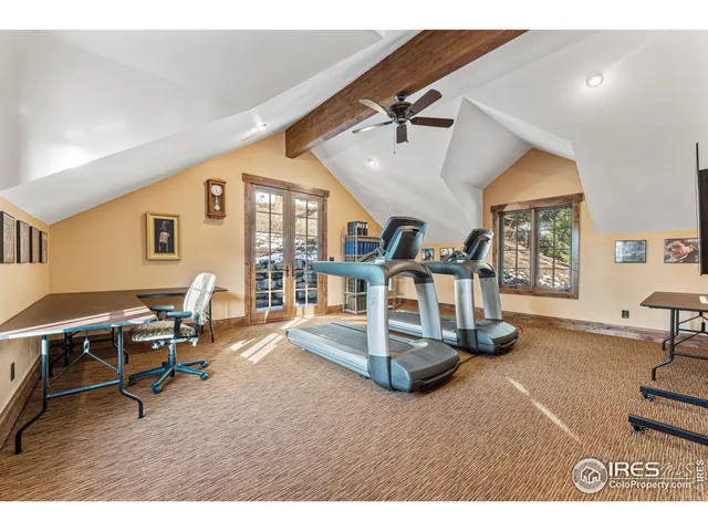 a room with gym equipment and a table