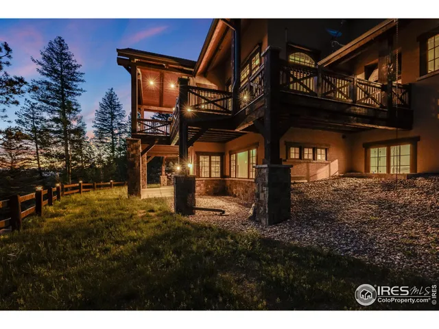 an aerial view of a house with yard table and chairs
