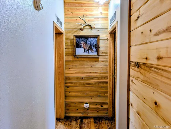 a view of walk in closet with clothes