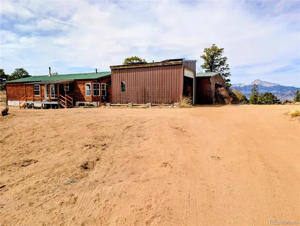 a view of a house with wooden floor and a yard