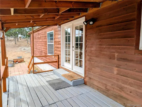 a view of outdoor space with wooden floor and yard