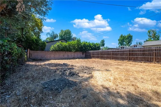 a view of backyard with green space