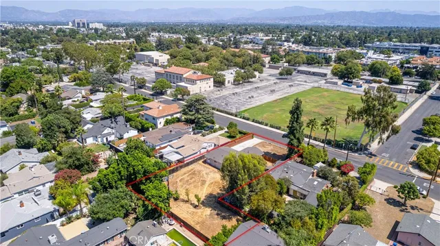 an aerial view of residential houses with outdoor space