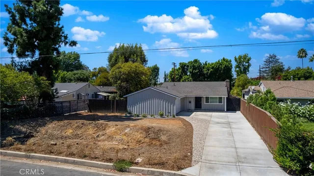 a view of house with yard