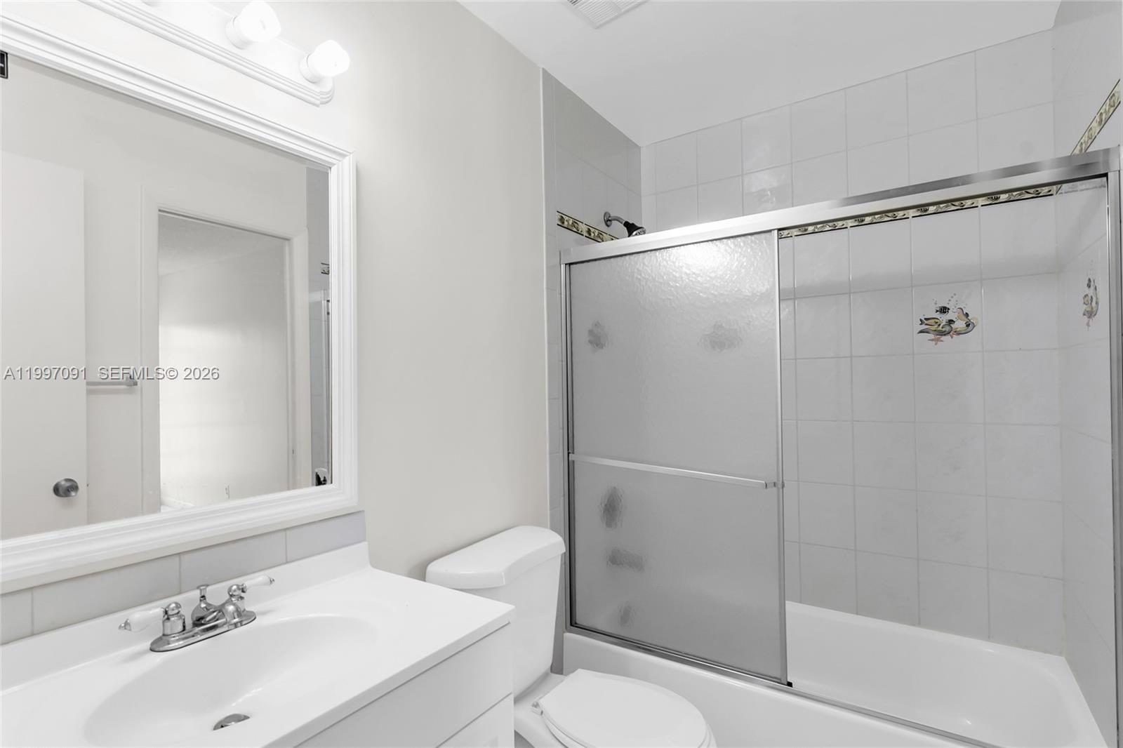 6323 Southwest 147th Pl Circle Miami, FL 33193 - Photo 15 of 29 a bathroom with a sink toilet and shower