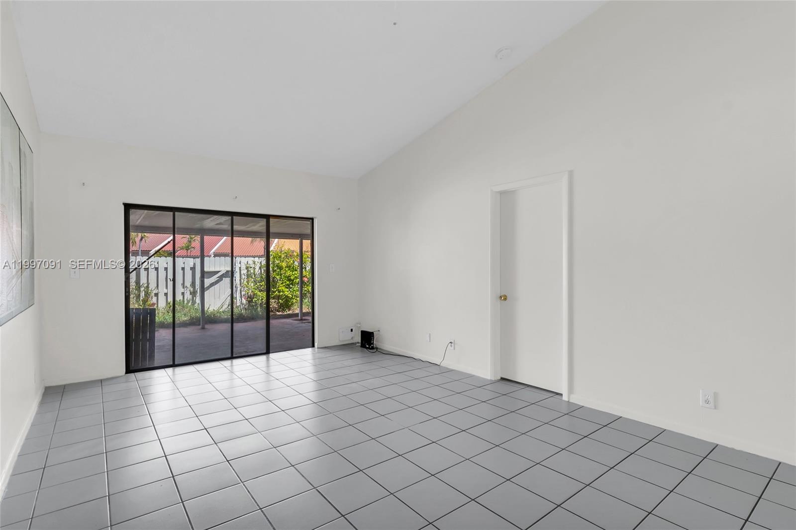 6323 Southwest 147th Pl Circle Miami, FL 33193 - Photo 8 of 29 a view of an empty room and window