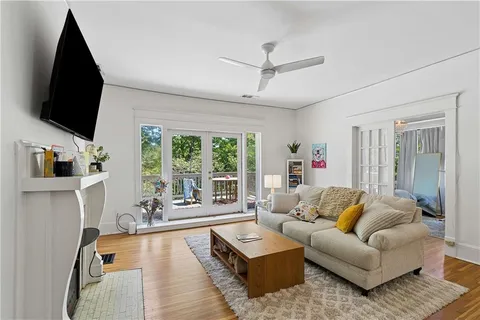 a living room with furniture fireplace and flat screen tv