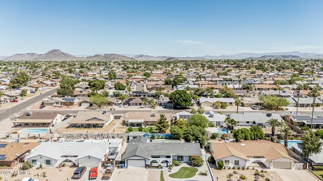 a view of a house with a tree in the background