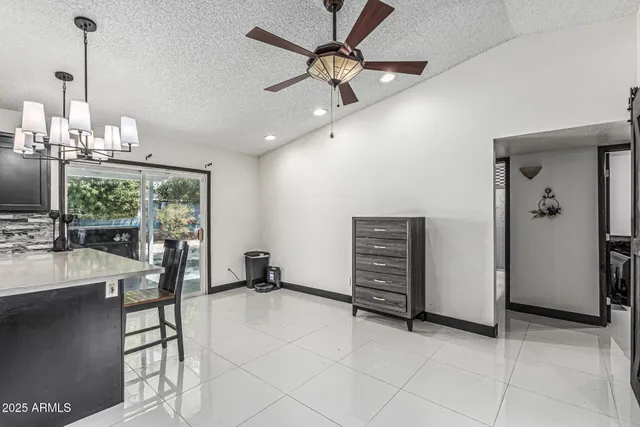 a room with furniture and a flat screen tv