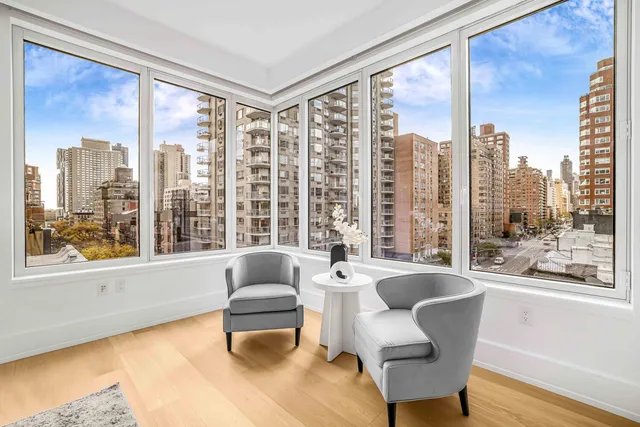 a bedroom with a large bed and a couch