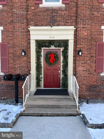 a front view of house with stairs