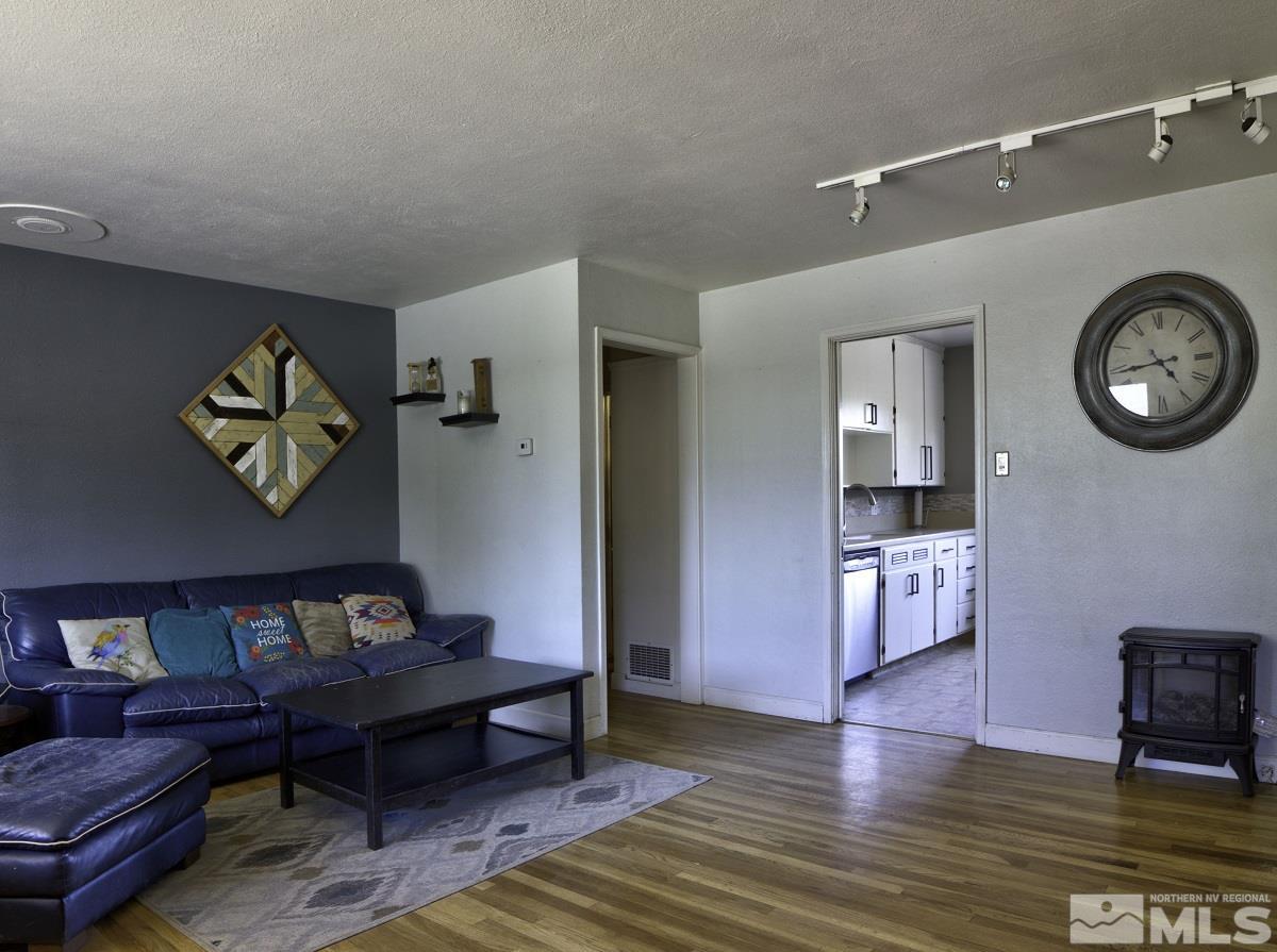 650 Lester Avenue Reno, NV 89502 - Photo 4 of 15 a living room with furniture and wooden floor
