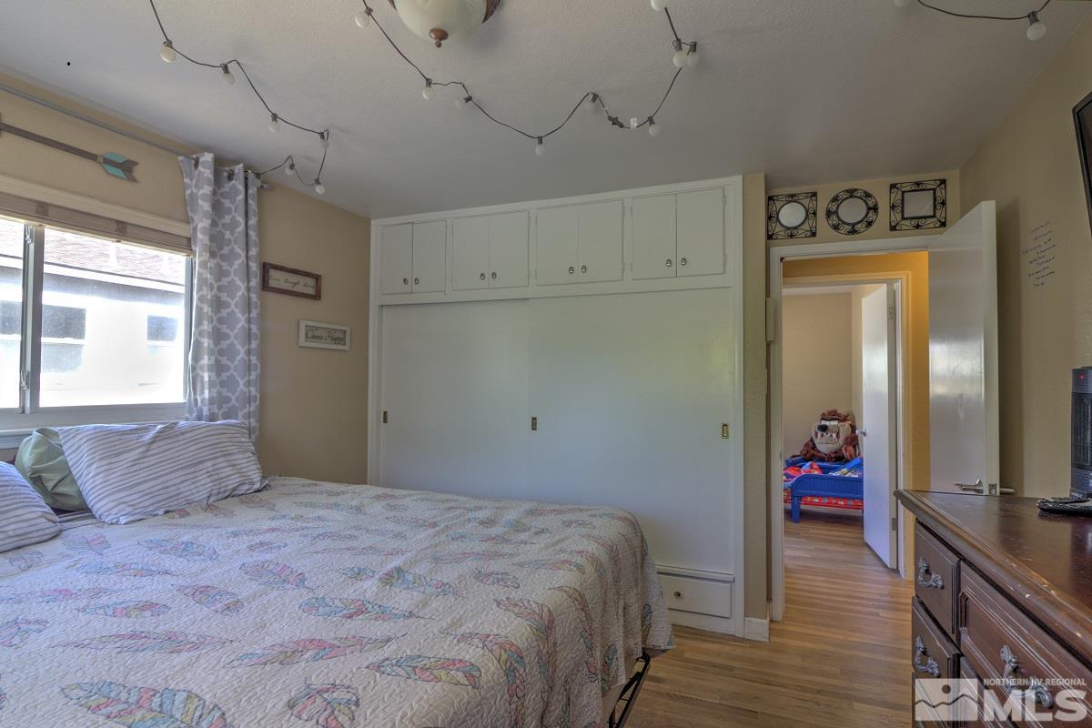 650 Lester Avenue Reno, NV 89502 - Photo 8 of 15 a bedroom with a bed and a large window