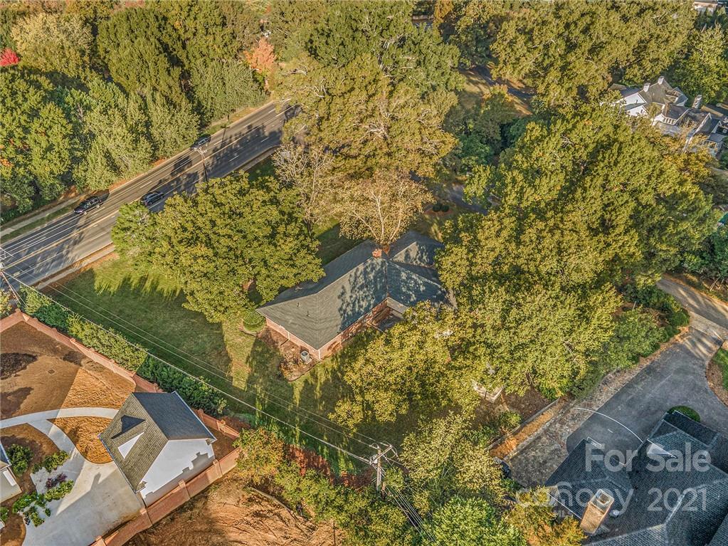 3301 Sharon Road Charlotte, NC 28211 - Photo 13 of 15 a view of a yard with plants and wooden fence