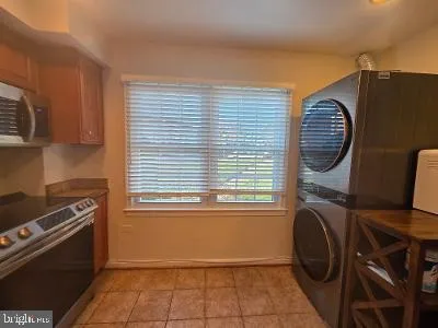 a view of a kitchen with washer and dryer