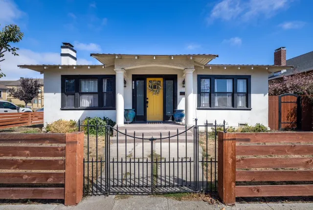 a view of a house with a small yard