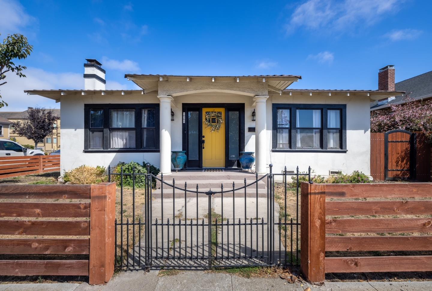a view of a house with a small yard
