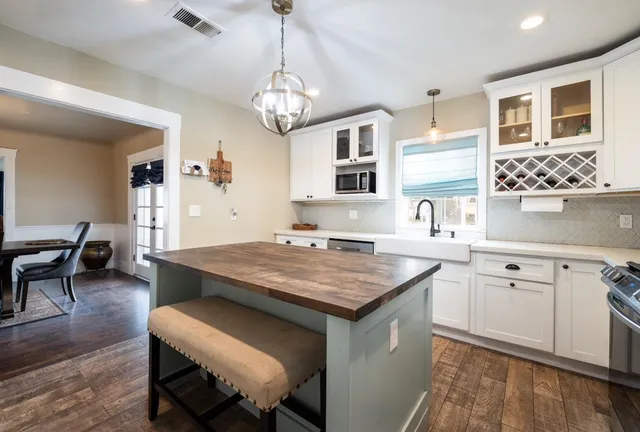 a view of a kitchen wooden cabinets and counter space