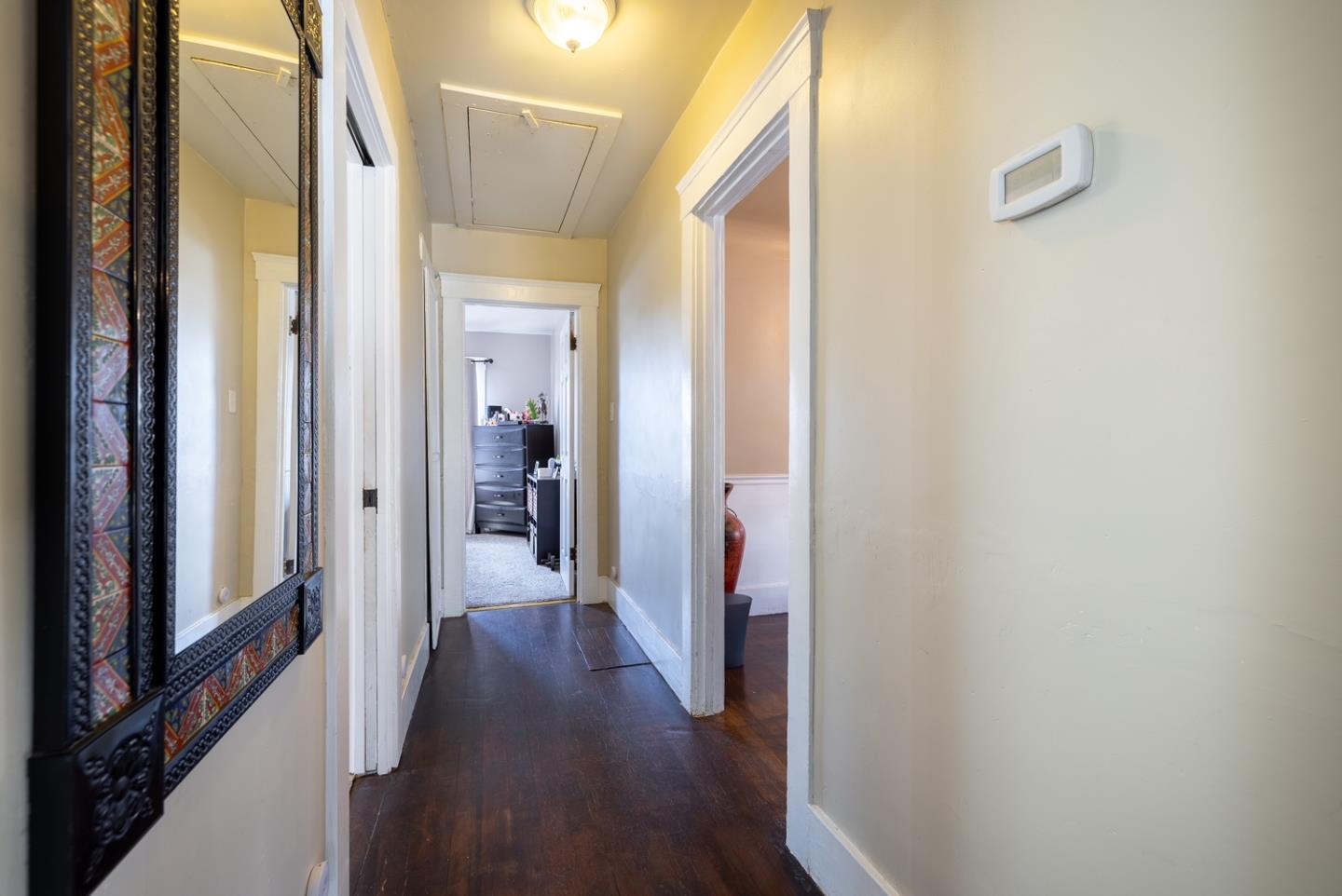 128 Central Avenue Salinas, CA 93901 - Photo 22 of 27 a view of a hallway with wooden floor