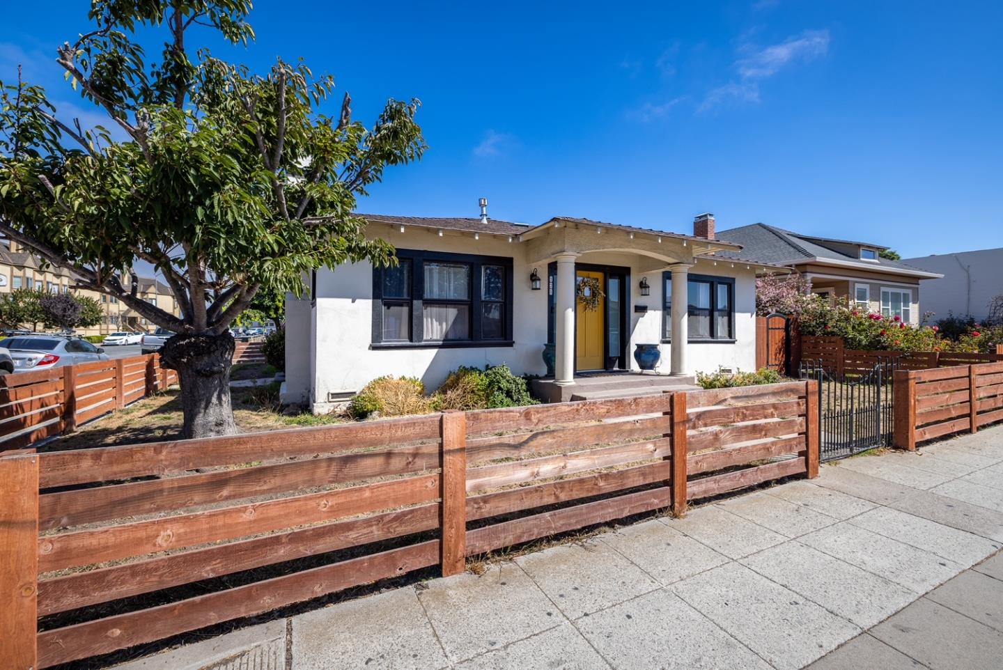128 Central Avenue Salinas, CA 93901 - Photo 3 of 27 a view of a house with backyard and a tree