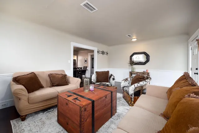 a living room with furniture and a couch