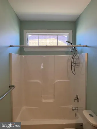 a bathroom with a shower and a bathtub