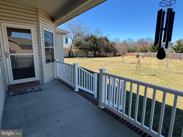 a view of balcony with yard