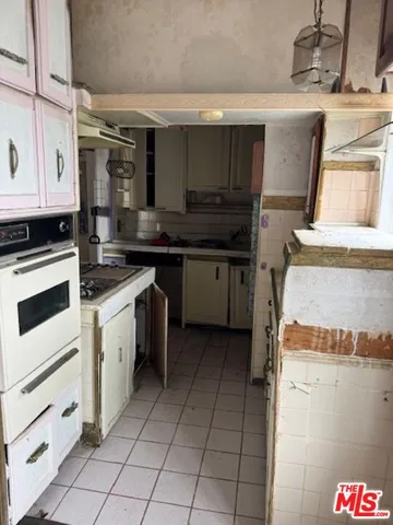a kitchen with a stove and a sink
