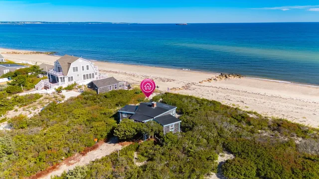 a aerial view of a house with a ocean view