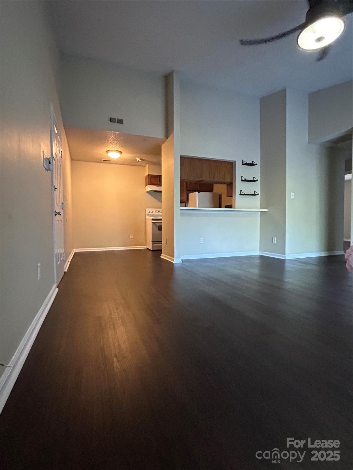 9629 Vinca Circle, Unit H Charlotte, NC 28213 - Photo 8 of 10 a view of a room with wooden floor