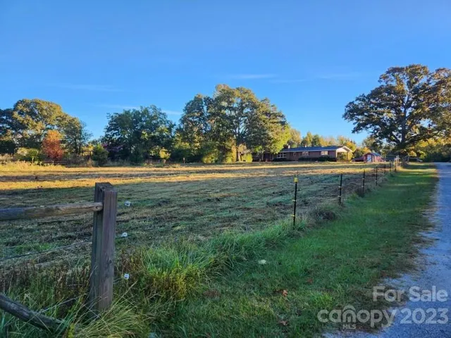 a view of a yard with an ocean view