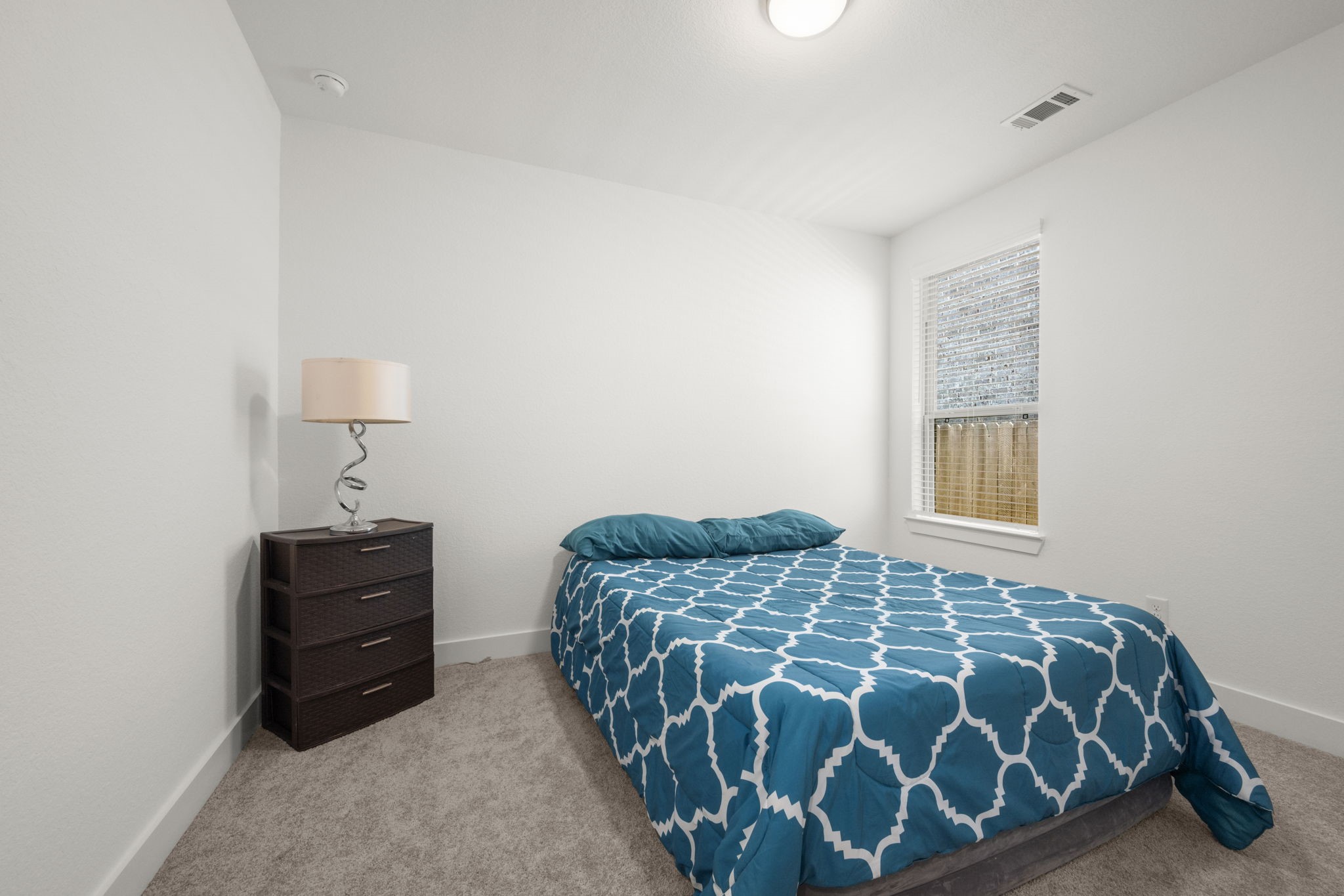 13035 Wandering Rdg Lane Conroe, TX 77302 - Photo 22 of 28 a bedroom with a bed and a window