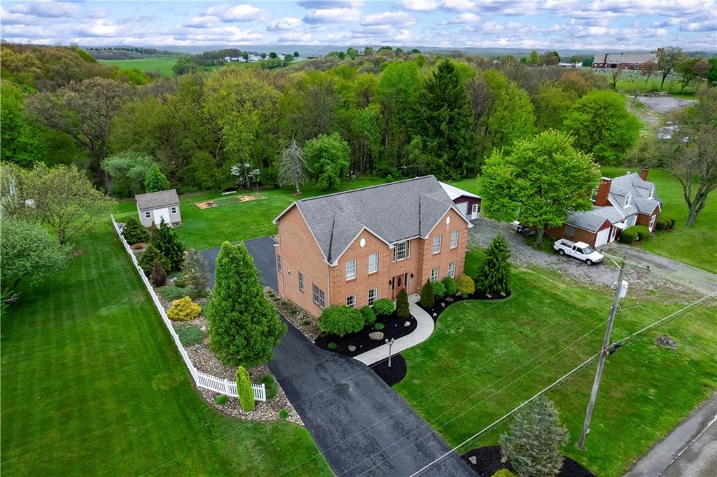 829 Hartzell School Road New Brighton, PA 15066 - Photo 39 of 50 an aerial view of a house with a yard