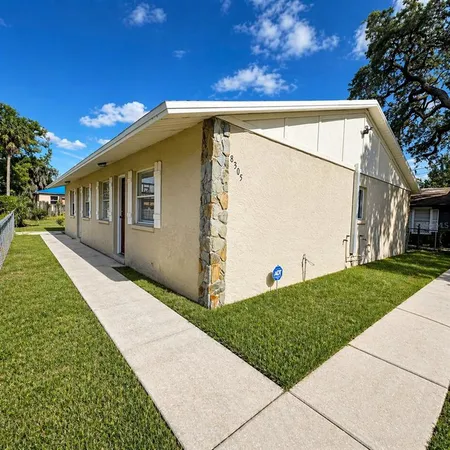 a view of a back yard of the house