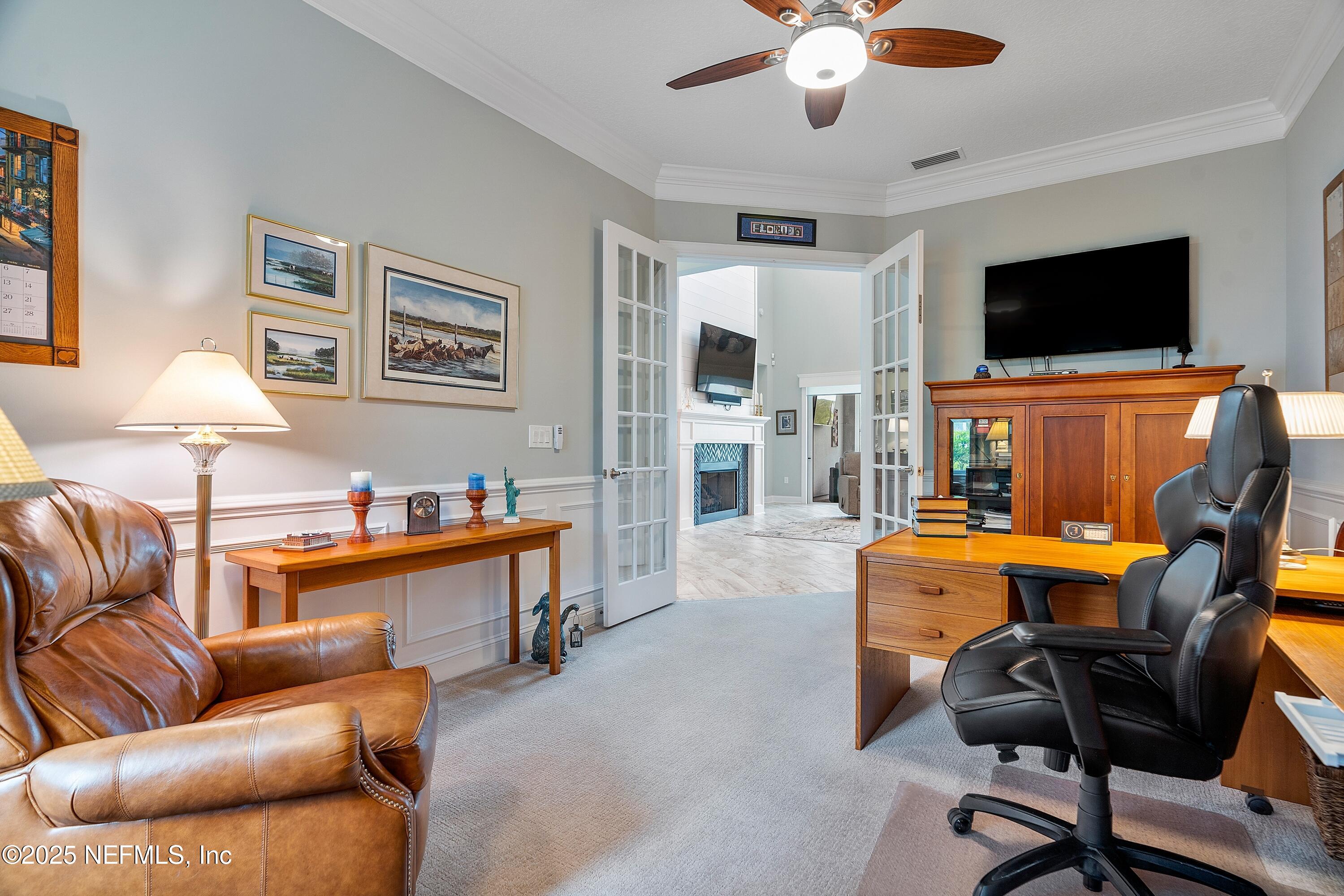 220 Honey Blossom Road St. Johns, FL 32259 - Photo 19 of 99 a living room with furniture and a flat screen tv