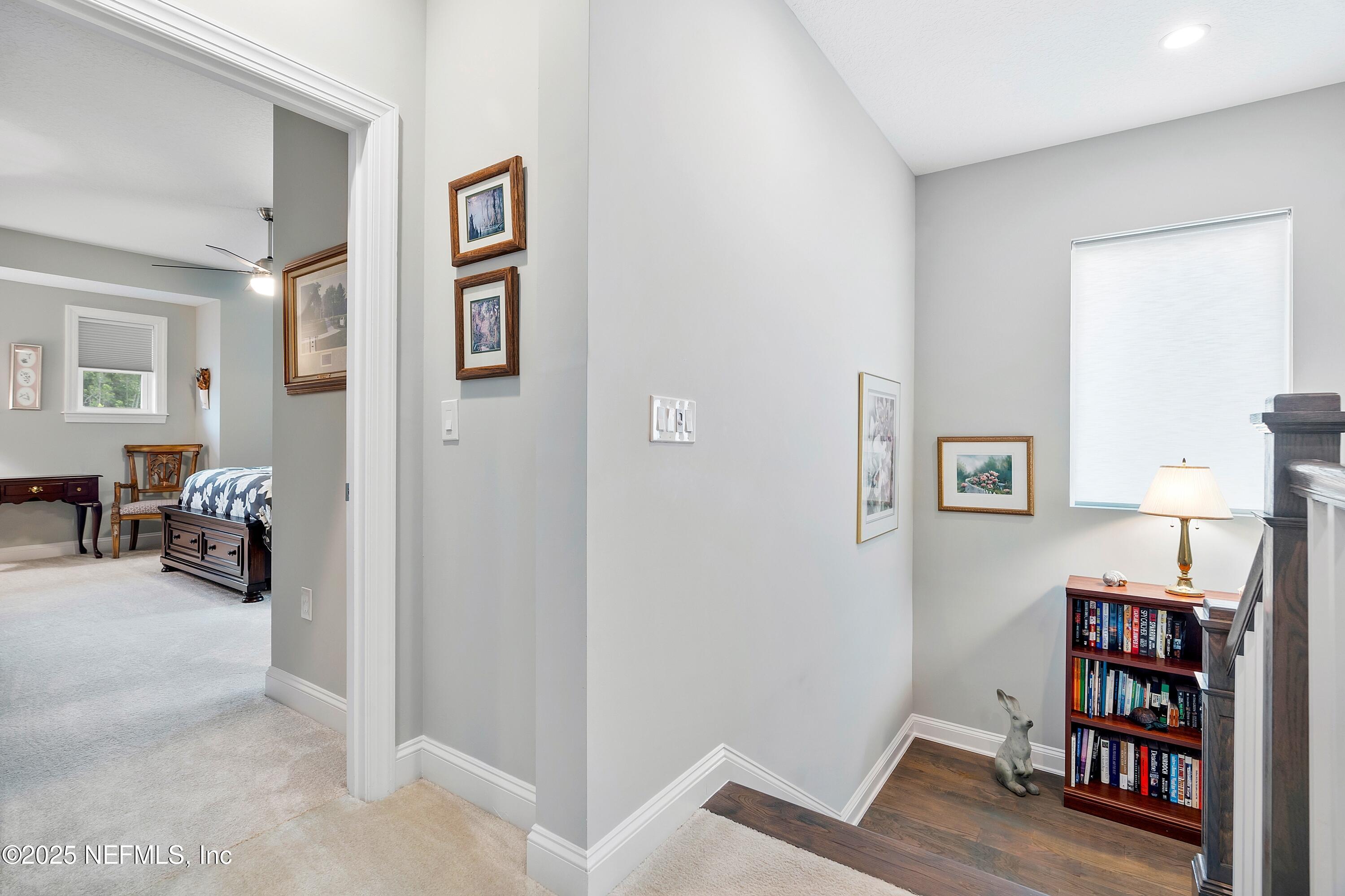 220 Honey Blossom Road St. Johns, FL 32259 - Photo 45 of 99 a view of a livingroom with lounge chair and a bookshelf