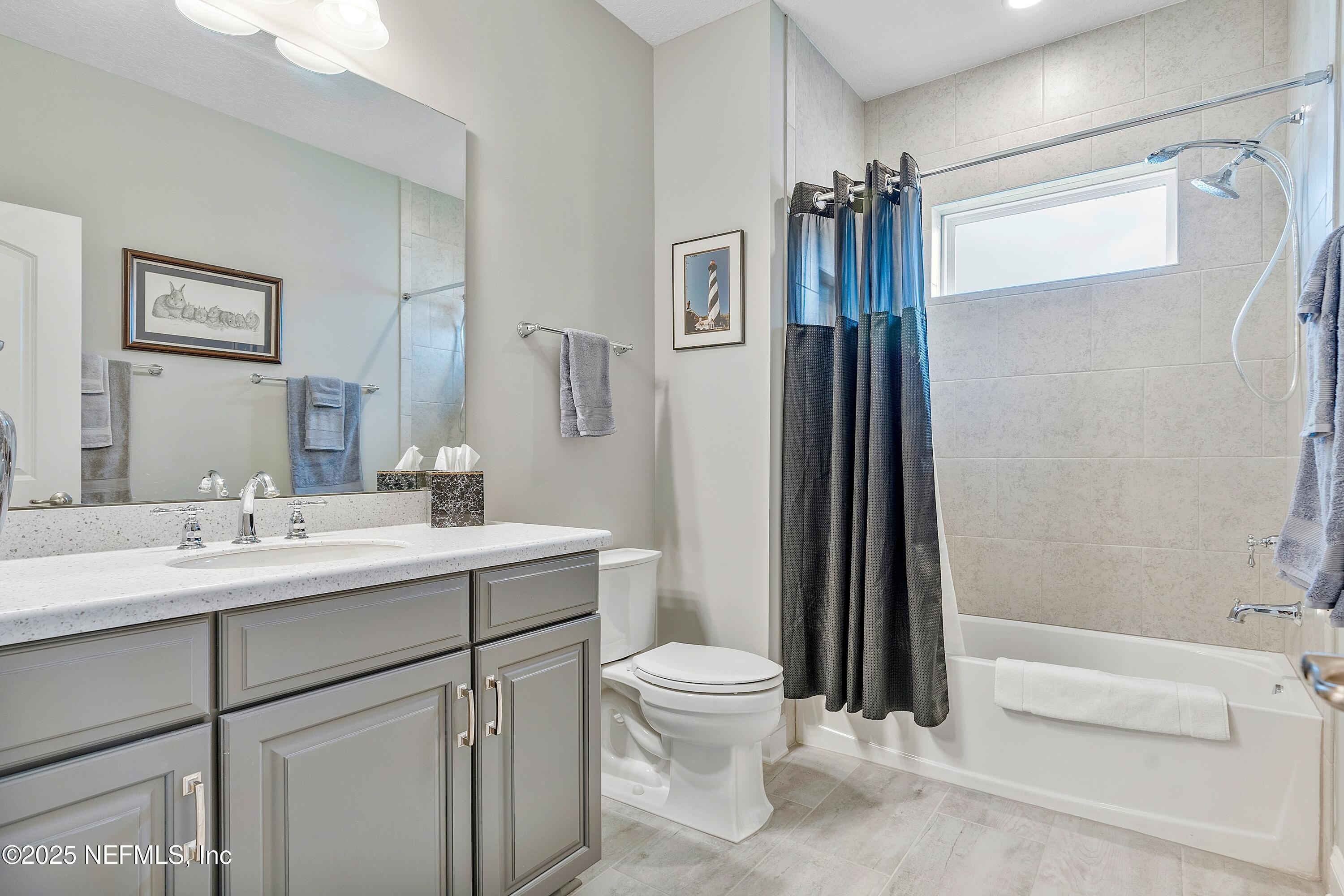 220 Honey Blossom Road St. Johns, FL 32259 - Photo 57 of 99 a bathroom with a sink a toilet and shower