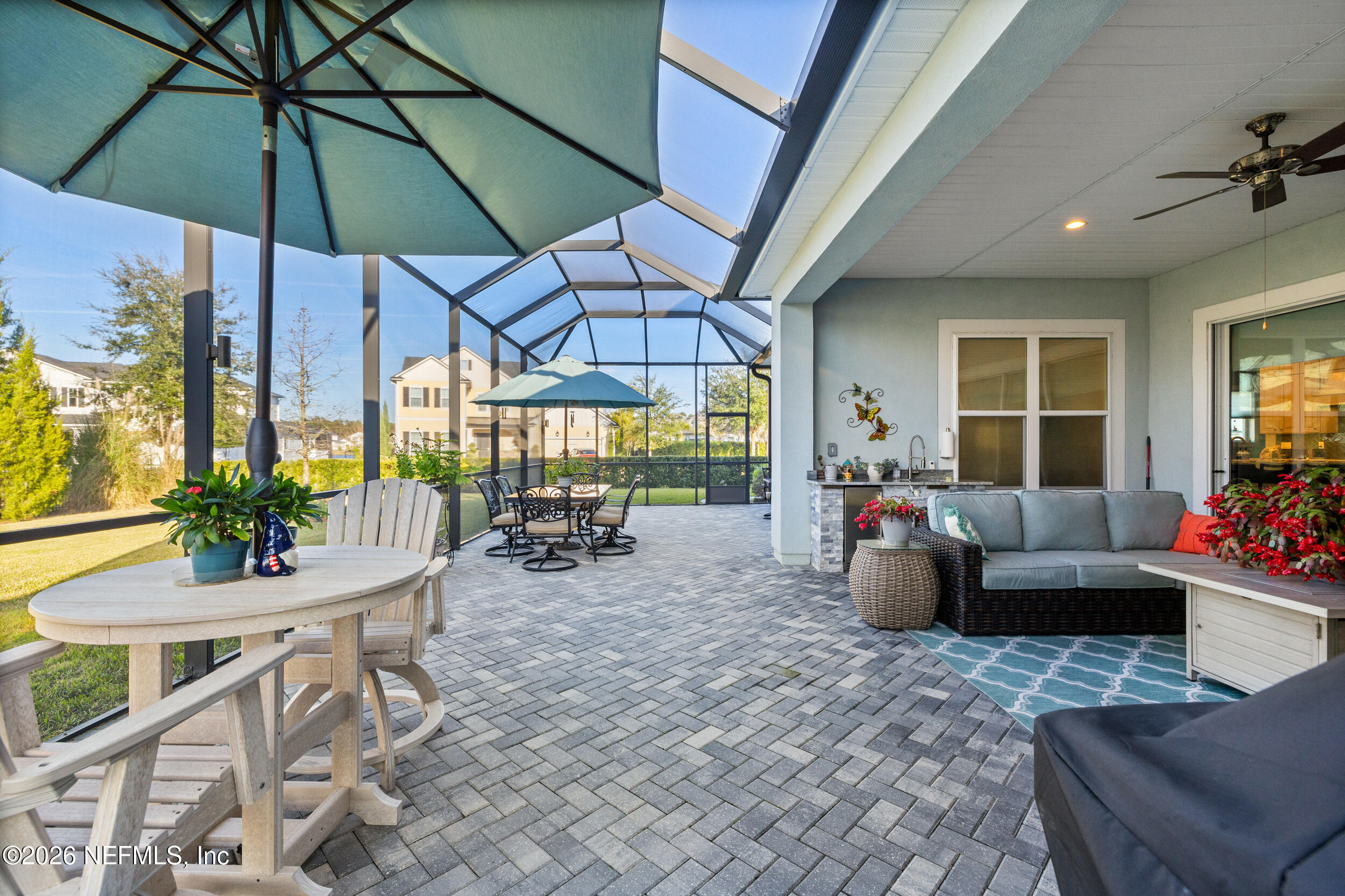220 Honey Blossom Road St. Johns, FL 32259 - Photo 61 of 99 a living room with furniture and a flat screen tv