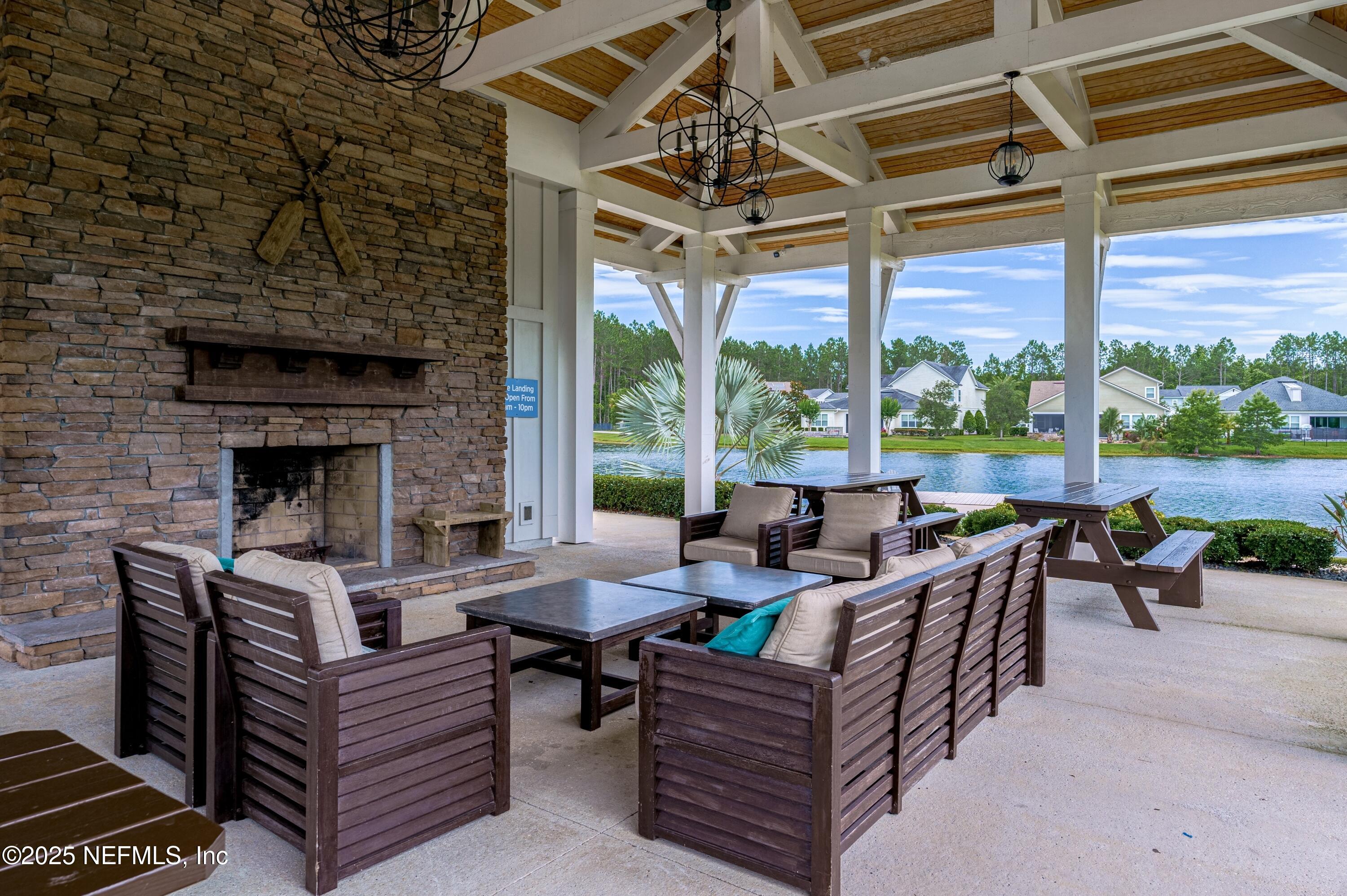 220 Honey Blossom Road St. Johns, FL 32259 - Photo 95 of 99 a outdoor living space with patio furniture and a fireplace
