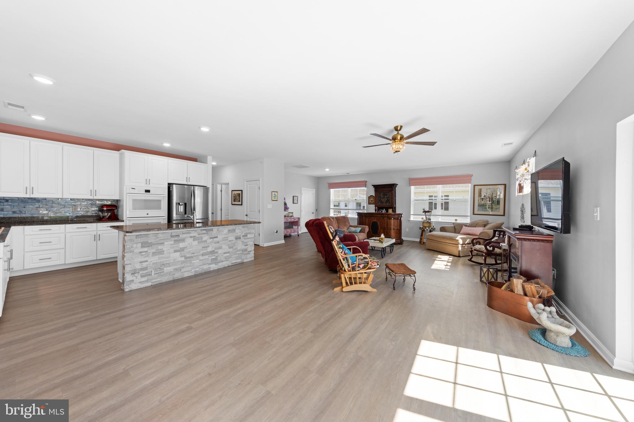 24525 Merlot Drive Lewes, DE 19958 - Photo 11 of 40 a living room with furniture and a flat screen tv