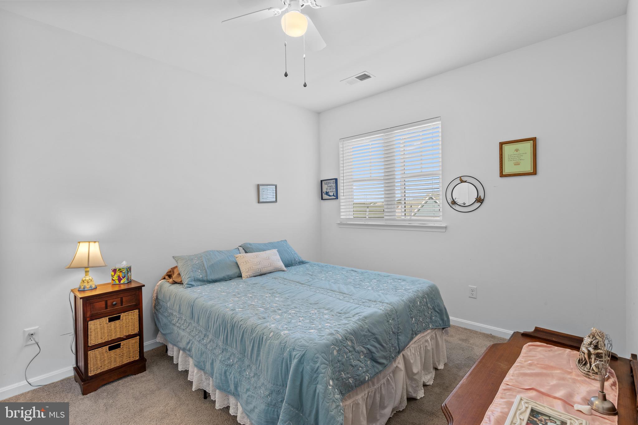 24525 Merlot Drive Lewes, DE 19958 - Photo 23 of 40 a bedroom with a bed and a window