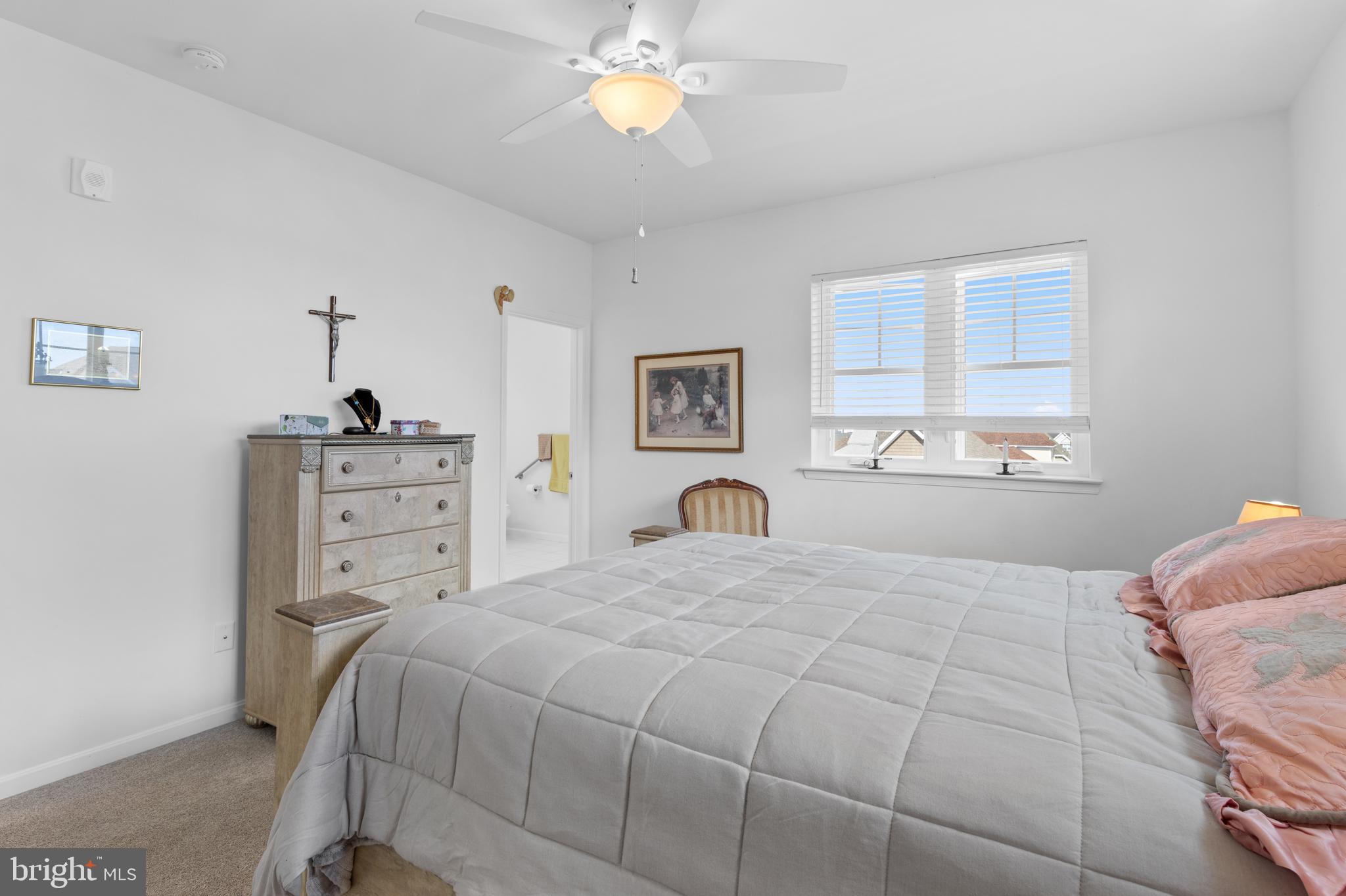 24525 Merlot Drive Lewes, DE 19958 - Photo 27 of 40 a bedroom with a bed and a dresser
